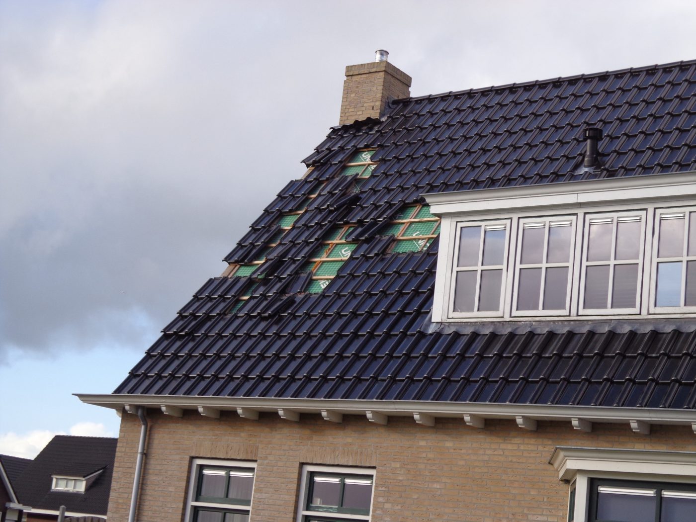 Storm damage wrong achoring roof tiles. Anchoring right patron and right roof tile hook Koramic roof tiles.