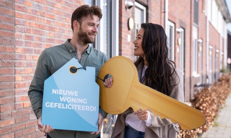 Cropped shot of an affectionate young father showing his young baby girl a stuffed toy while opening boxes in their new home on moving day