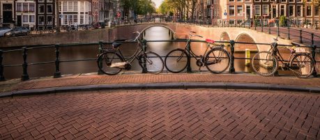 Leidesgracht and Keizersgracht canal in autumn as seen from a bridge. Captured in October 2017.