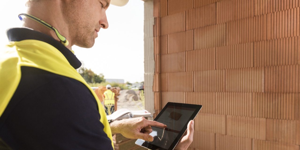 Construction worker with tablet computer